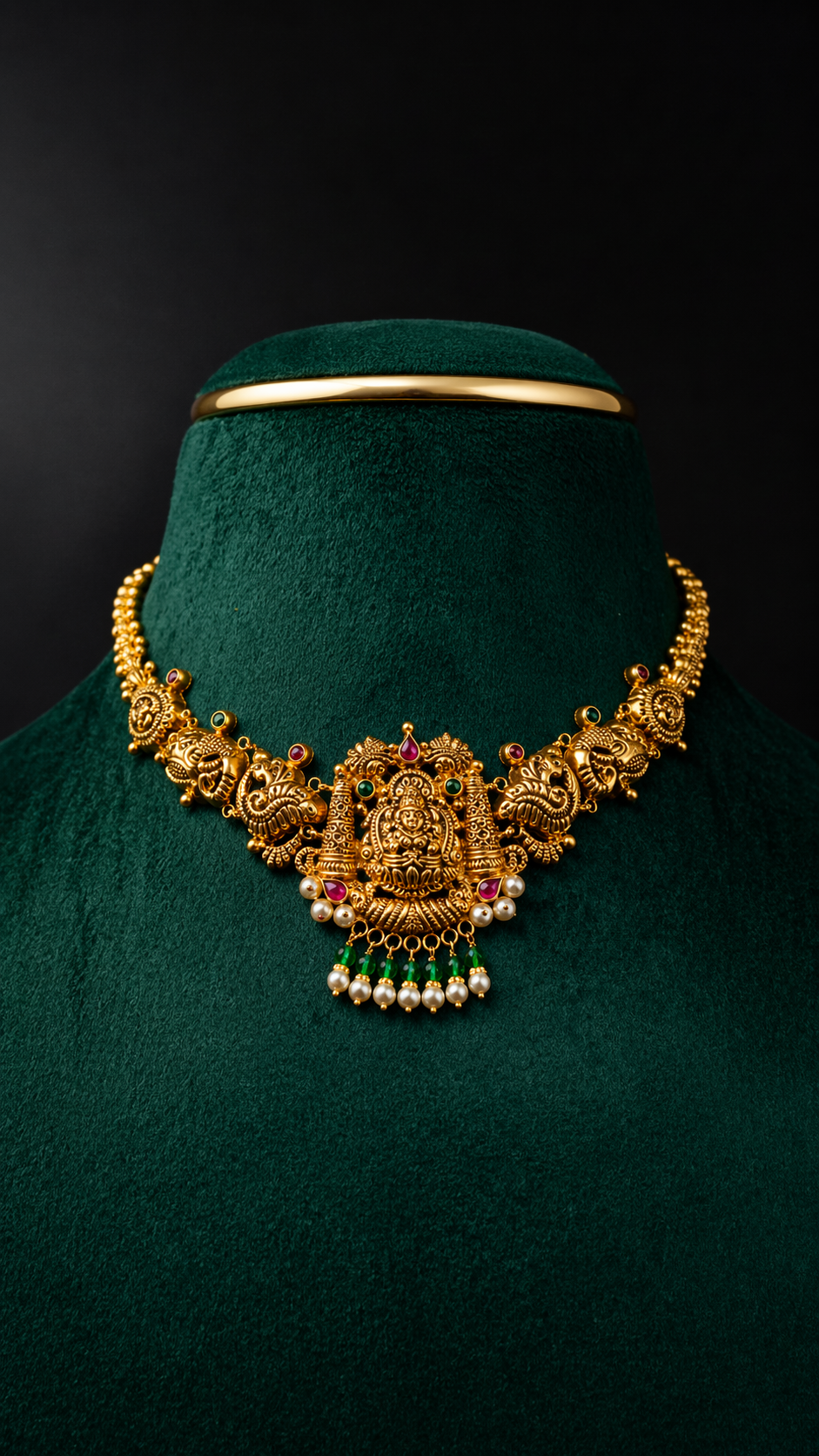 Lightweight 22K gold Gajalakshmi temple short necklace with elephant motifs, pearl-style bead drops and traditional South Indian craftsmanship.