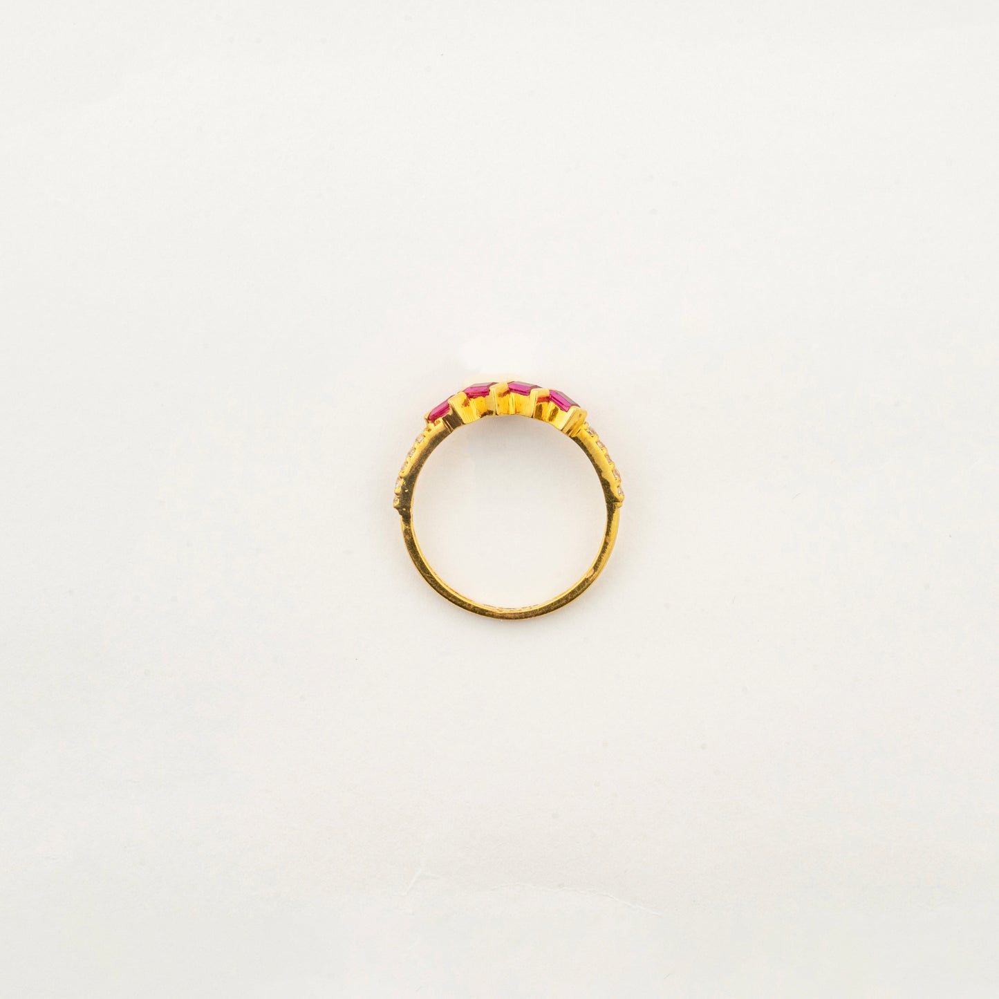 Top view of the handcrafted Sculptyx Rubra Cascade 22K gold ruby ring with precision-set ruby gemstones.