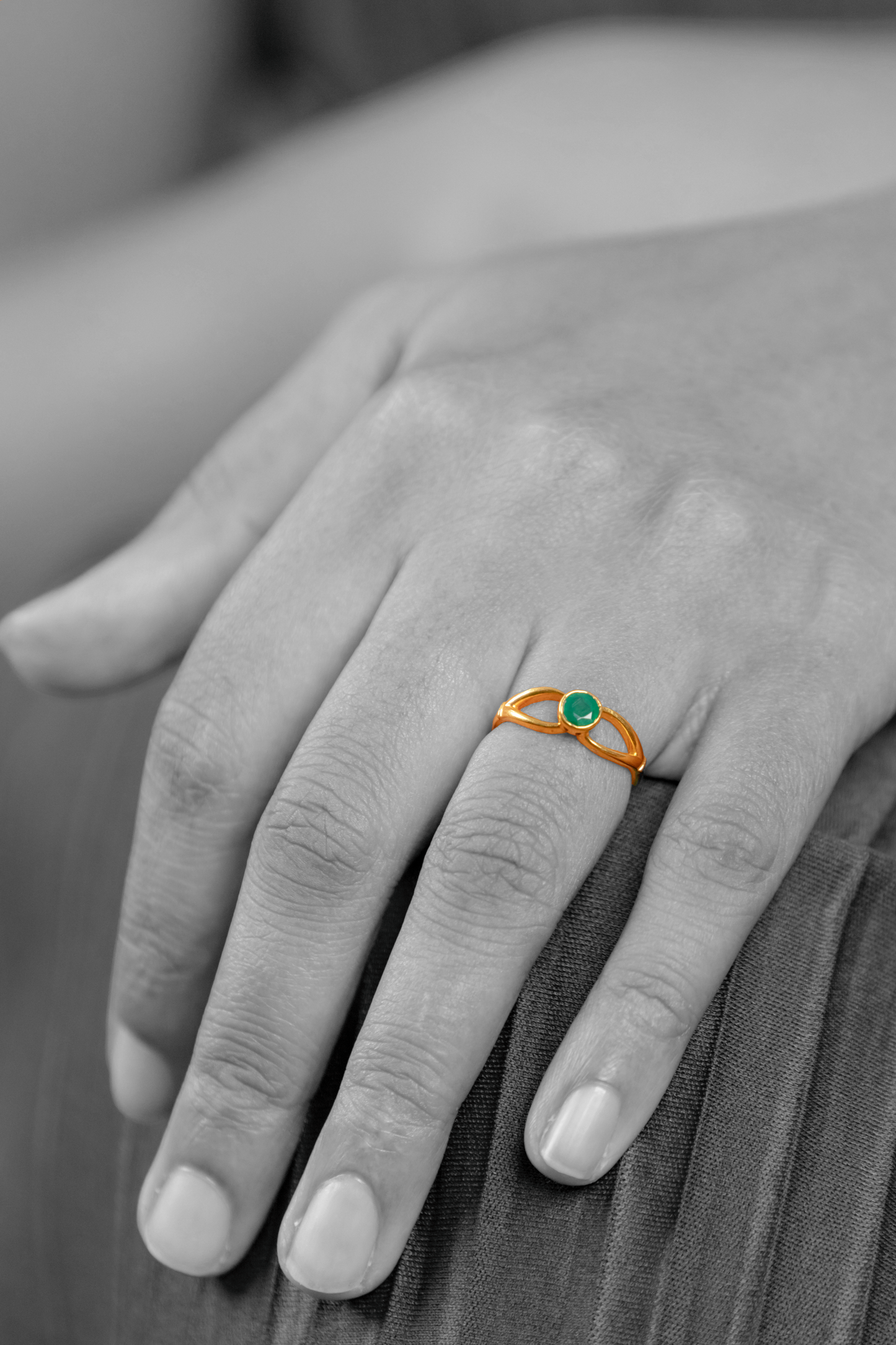 Model wearing the Sculptyx Verdant Axis handcrafted 22K gold emerald statement ring.