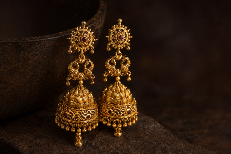 Sculptyx 22K gold Temple Jhumka Earrings featuring traditional South Indian craftsmanship with intricate Lakshmi motifs, bridal detailing, and luxurious handcrafted design.