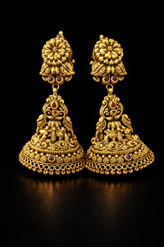 22K gold South Indian floral temple jhumka earrings with ruby stone accents and antique finish.