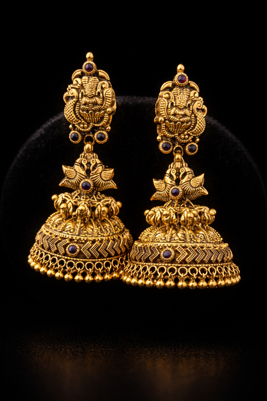 22K Gold Lakshmi Peacock Temple Jhumka earrings with ruby stone accents and antique finish.