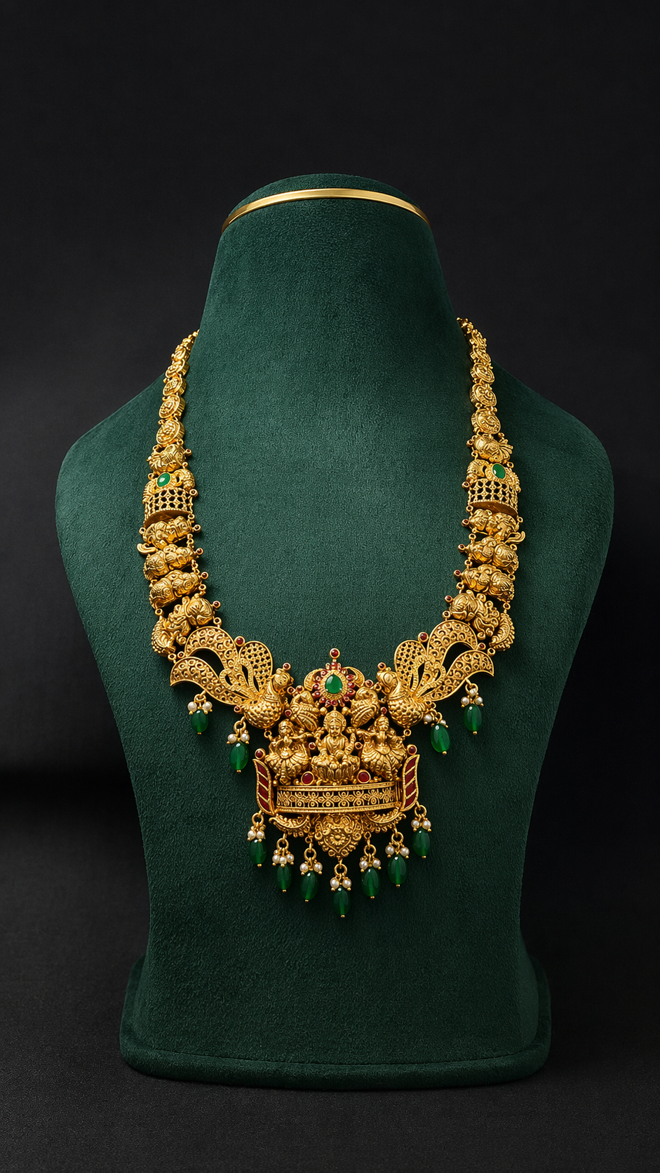 Handcrafted 22K Gold Twin Peacock Lakshmi Temple Haram necklace with Nakshi detailing, emerald green bead drops, and traditional South Indian bridal design.