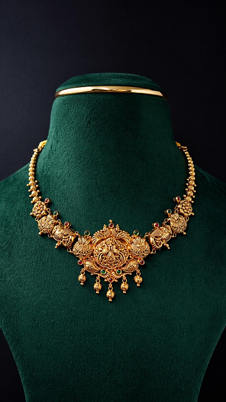 Lightweight 22K gold Lakshmi heritage short necklace with traditional South Indian craftsmanship and coloured decorative accents.