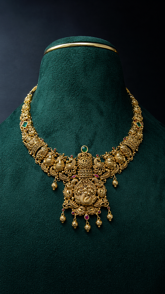 Lightweight 22K gold peacock temple necklace featuring an ornate heritage pendant with decorative coloured accents and hanging gold bead details.