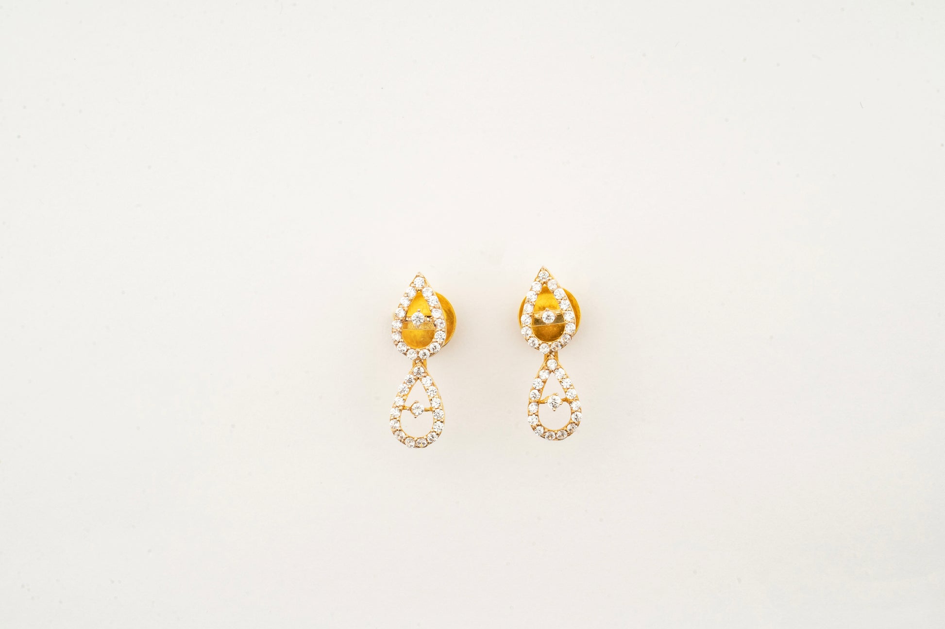 Sculptyx Celestial Drops handcrafted 18K gold crystal drop earrings featuring elegant teardrop Swarovski crystal accents.