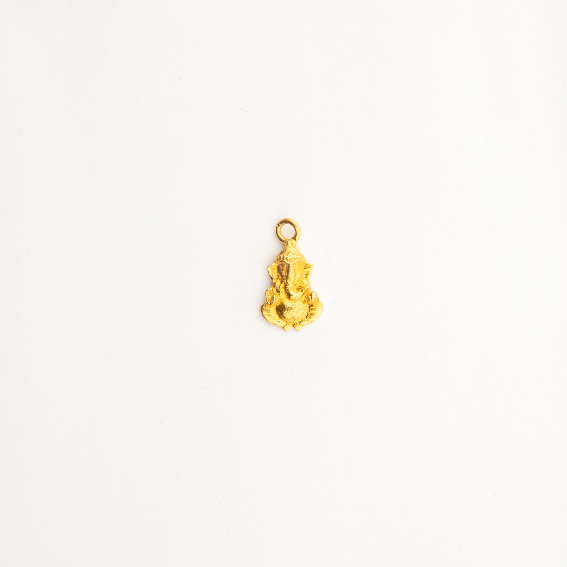 Sculptyx Divine Blessings handcrafted 22K gold pendant featuring an intricate Lord Ganesha design symbolizing wisdom, prosperity, and good fortune.