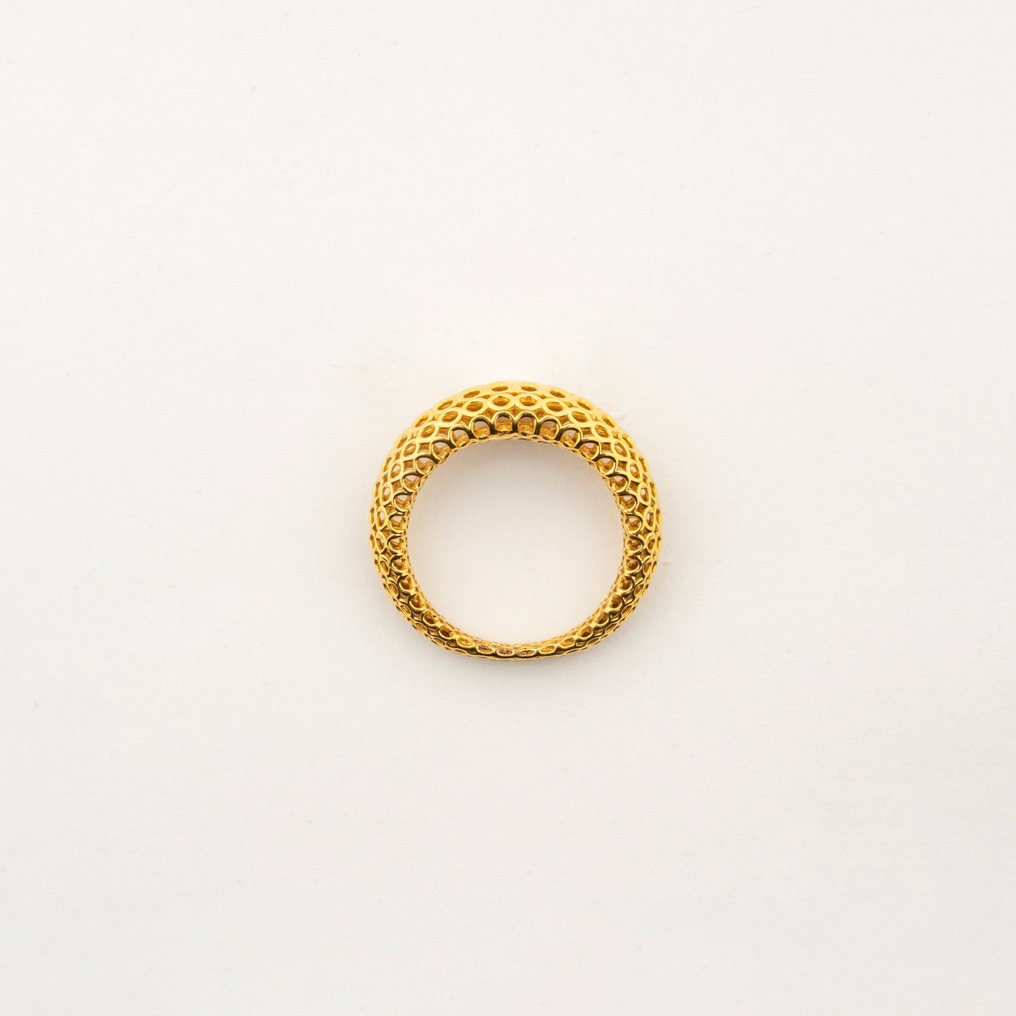 Top view of the Sculptyx Domaris Aurea handcrafted 22K gold domed band ring.