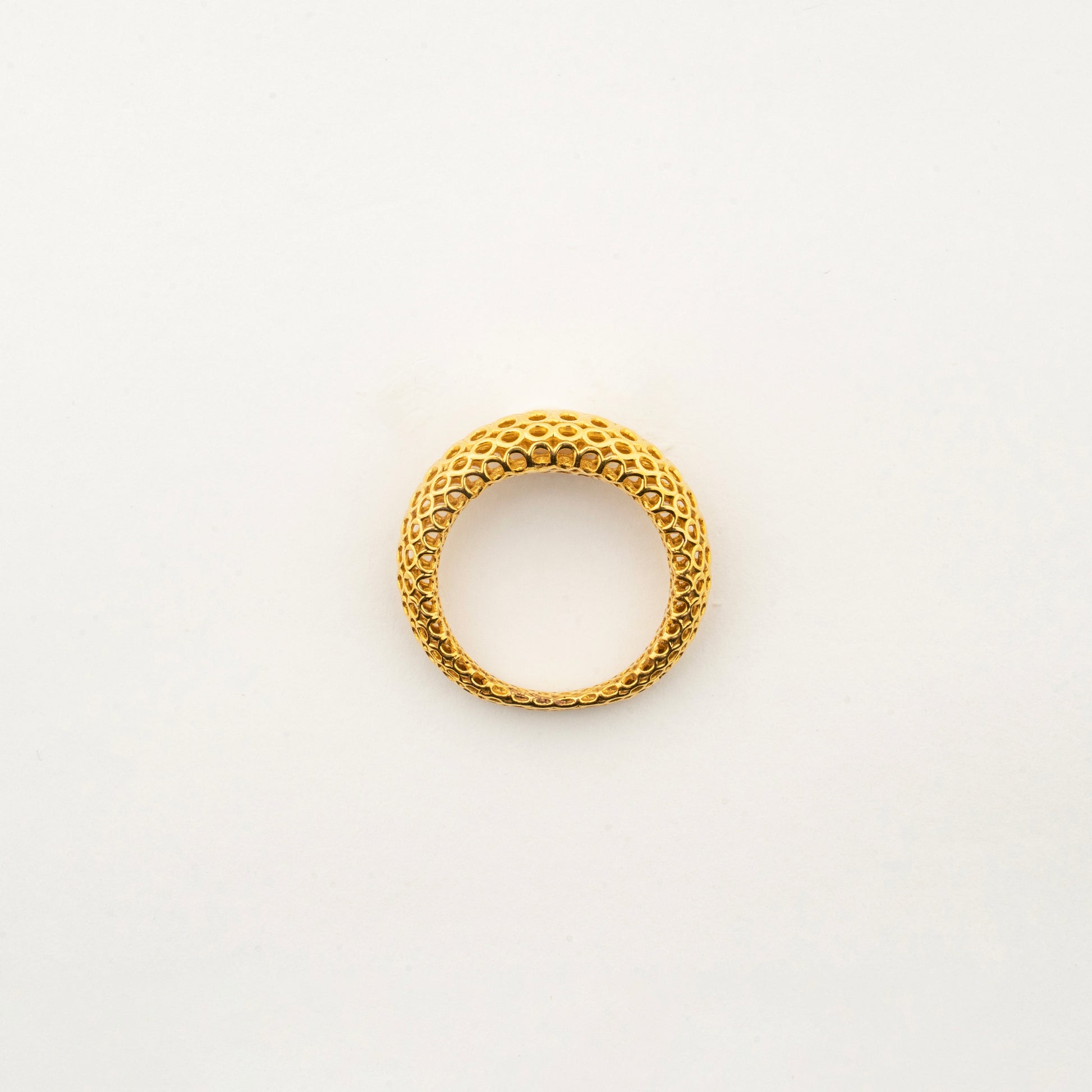 Top view of the Sculptyx Domaris Aurea handcrafted 22K gold domed band ring.