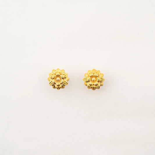 Sculptyx Florent Hexa handcrafted 18K gold floral stud earrings featuring a geometric six-petal botanical design.