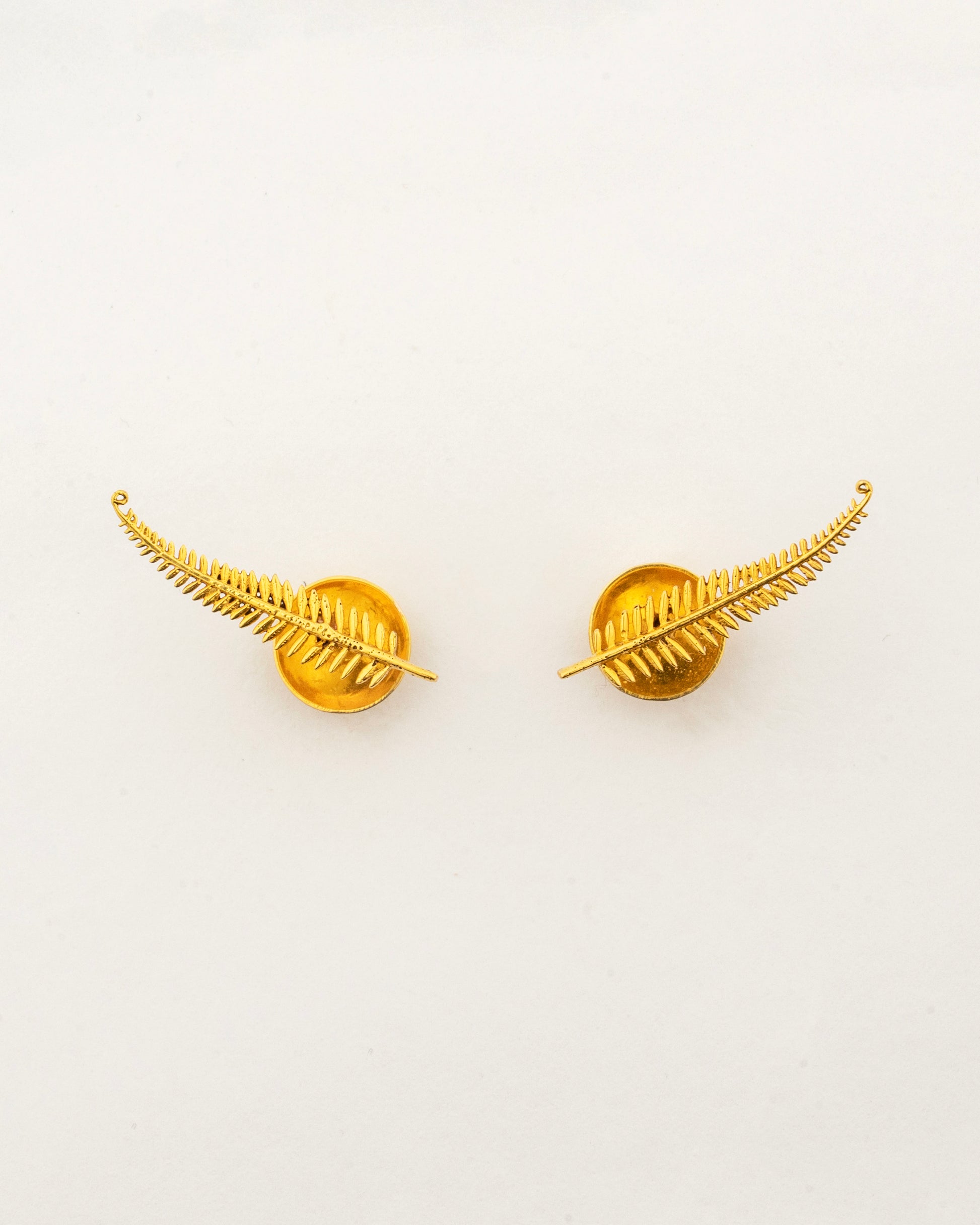 Sculptyx Frondelle handcrafted 18K gold botanical stud earrings inspired by elegant fern leaves and nature.