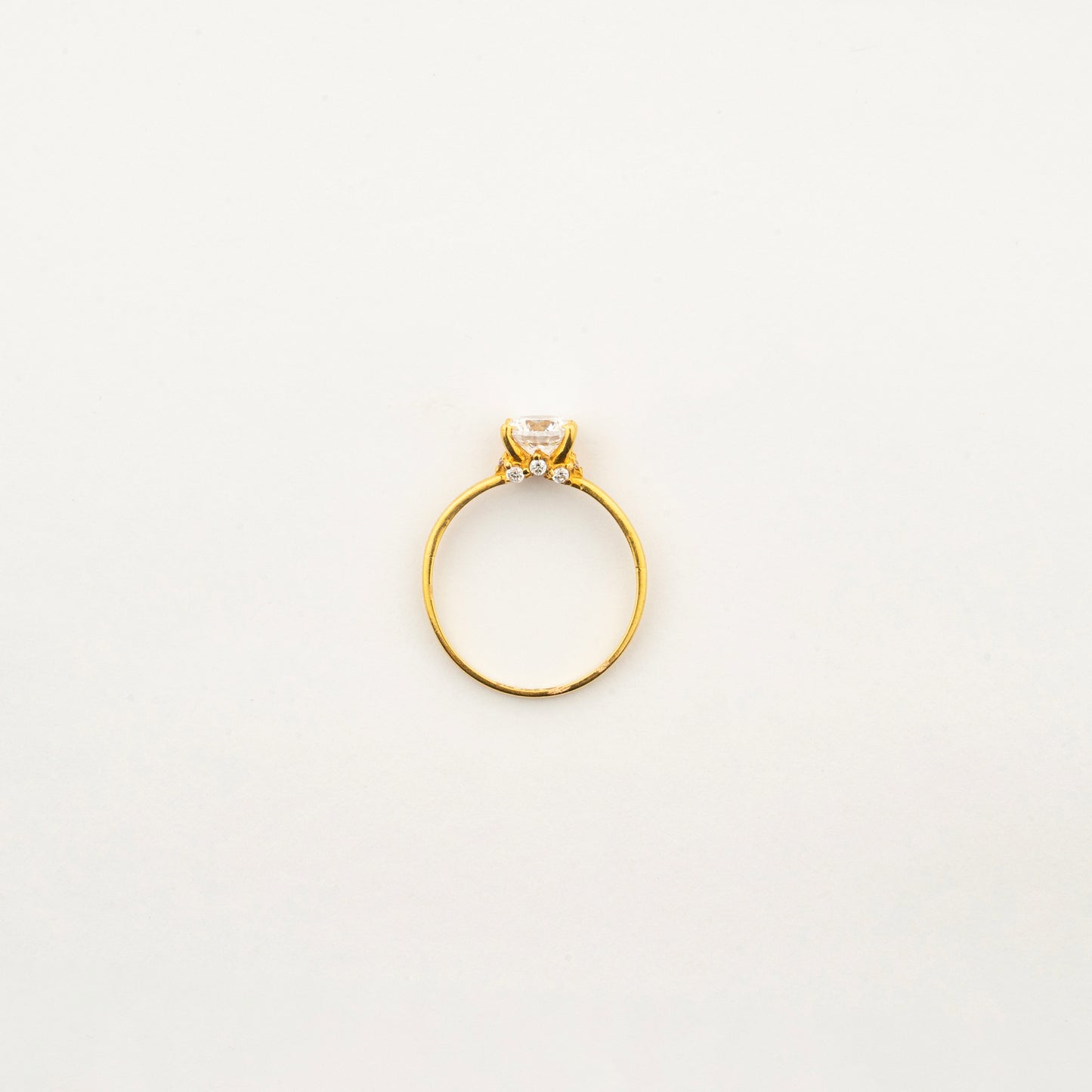 Top view of Sculptyx Glacier Crest 22K gold solitaire crystal ring showcasing its elegant handcrafted design.
