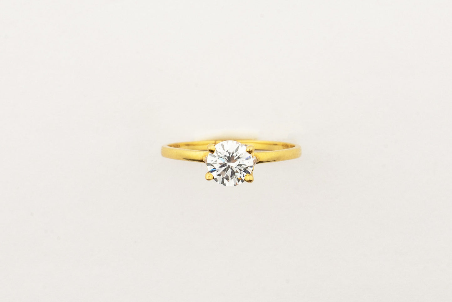 Sculptyx Glacier Crest handcrafted 22K gold solitaire ring featuring a brilliant Swarovski crystal centerpiece.