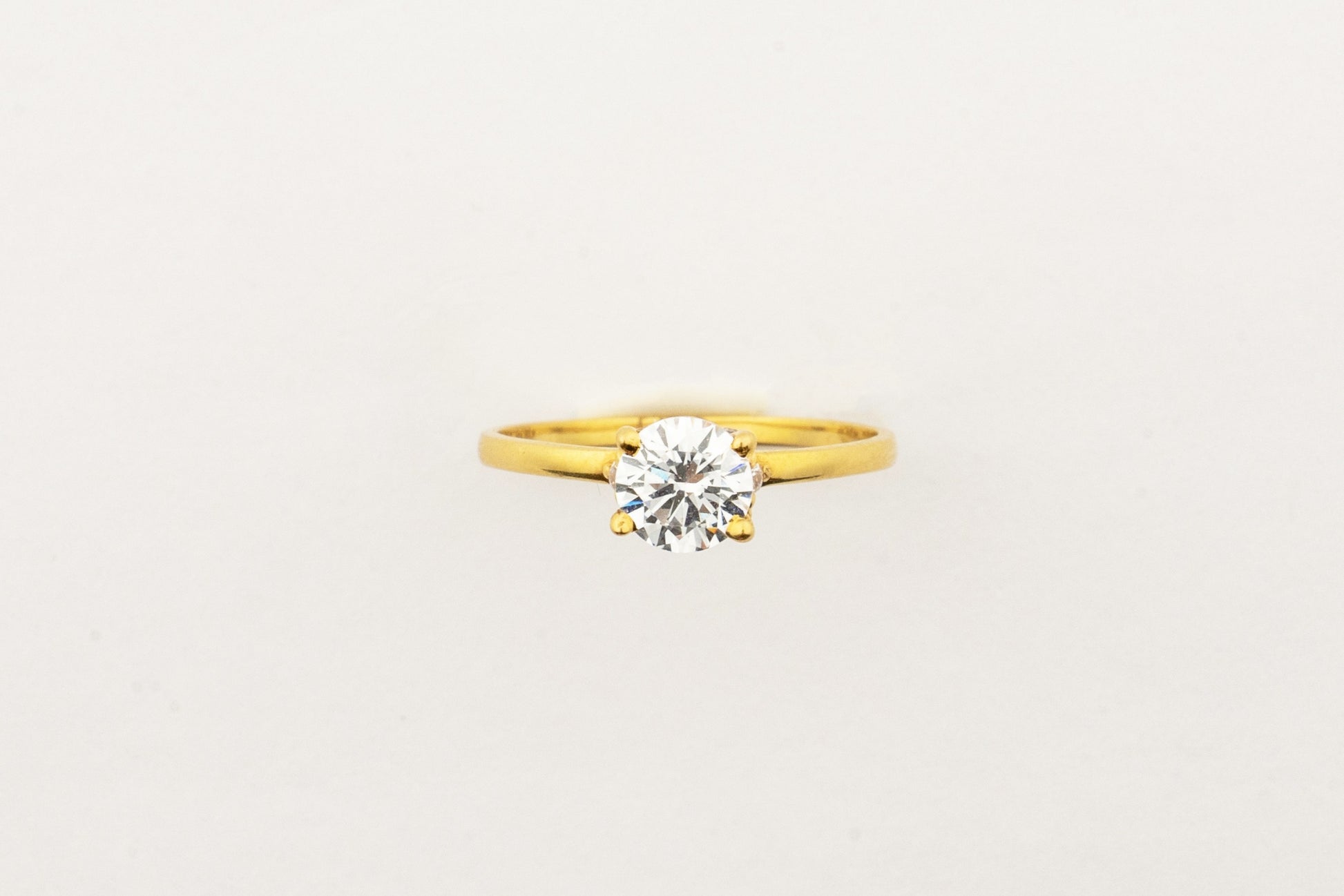 Sculptyx Glacier Crest handcrafted 22K gold solitaire ring featuring a brilliant Swarovski crystal centerpiece.