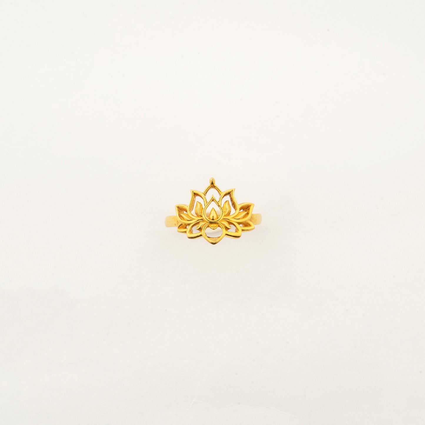 Top view of the handcrafted Sculptyx Golden Lotus 22K gold ring with an elegant lotus motif.
