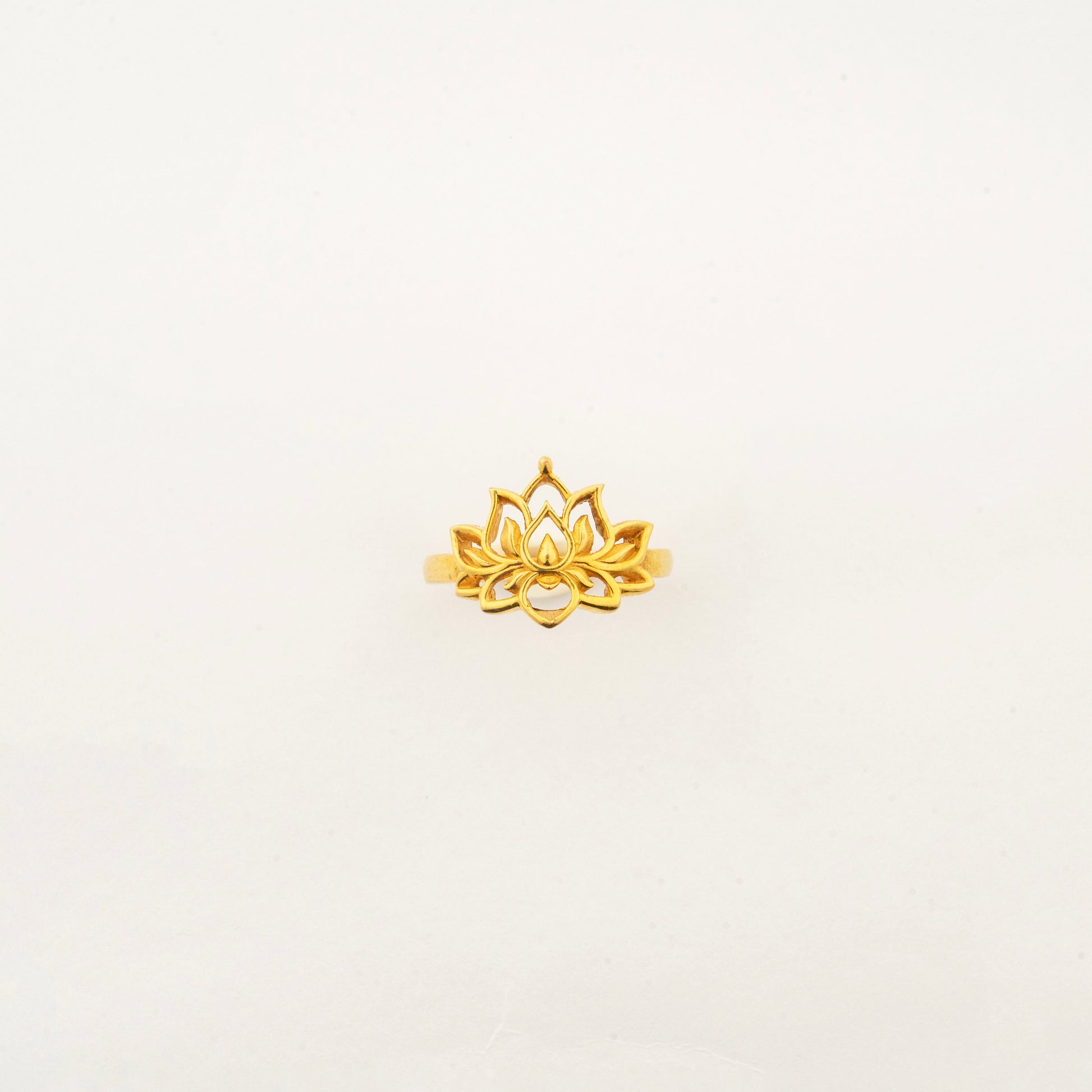 Top view of the handcrafted Sculptyx Golden Lotus 22K gold ring with an elegant lotus motif.
