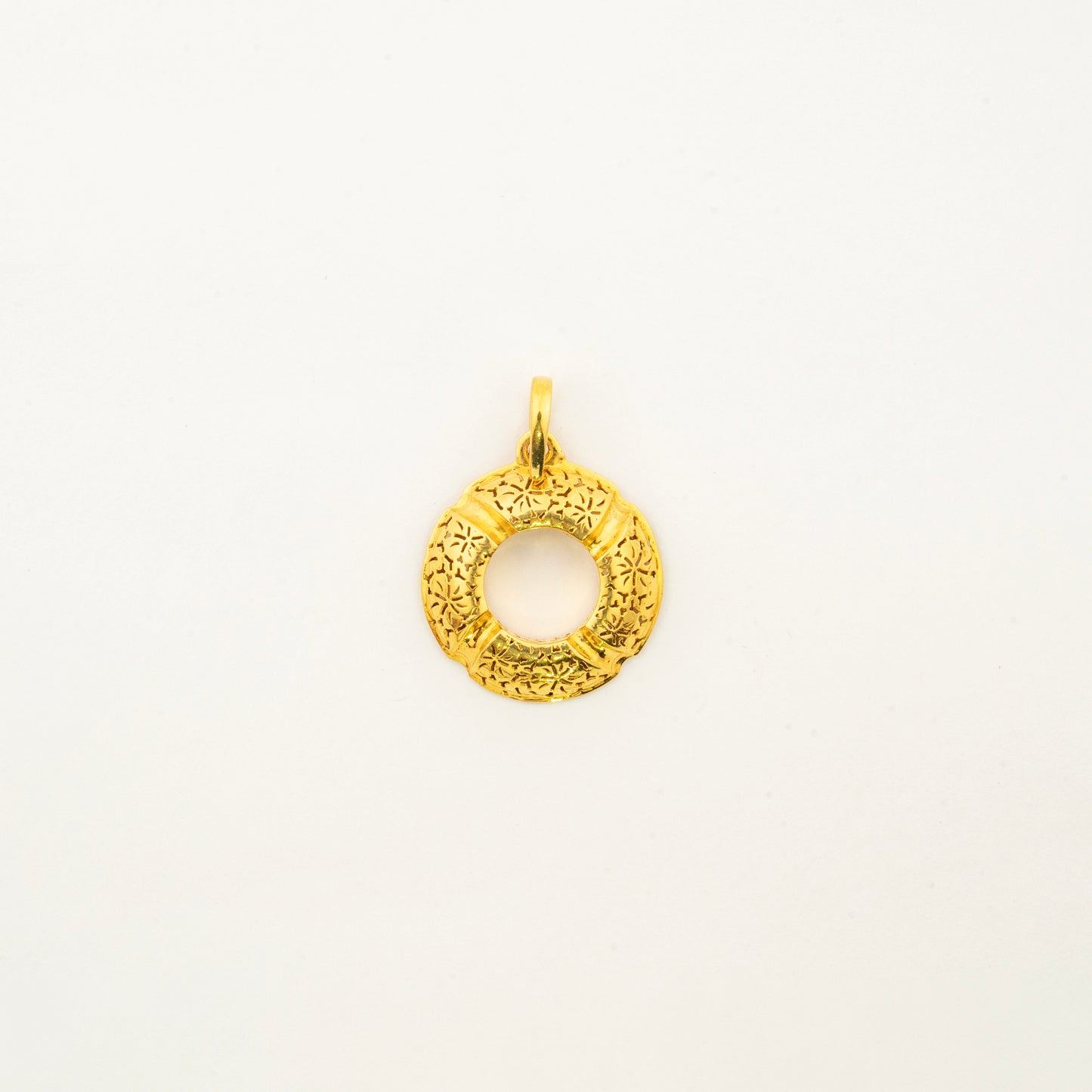 Sculptyx Golden Meridian handcrafted 18K gold circle pendant featuring a minimalist open circular design with a refined textured finish.