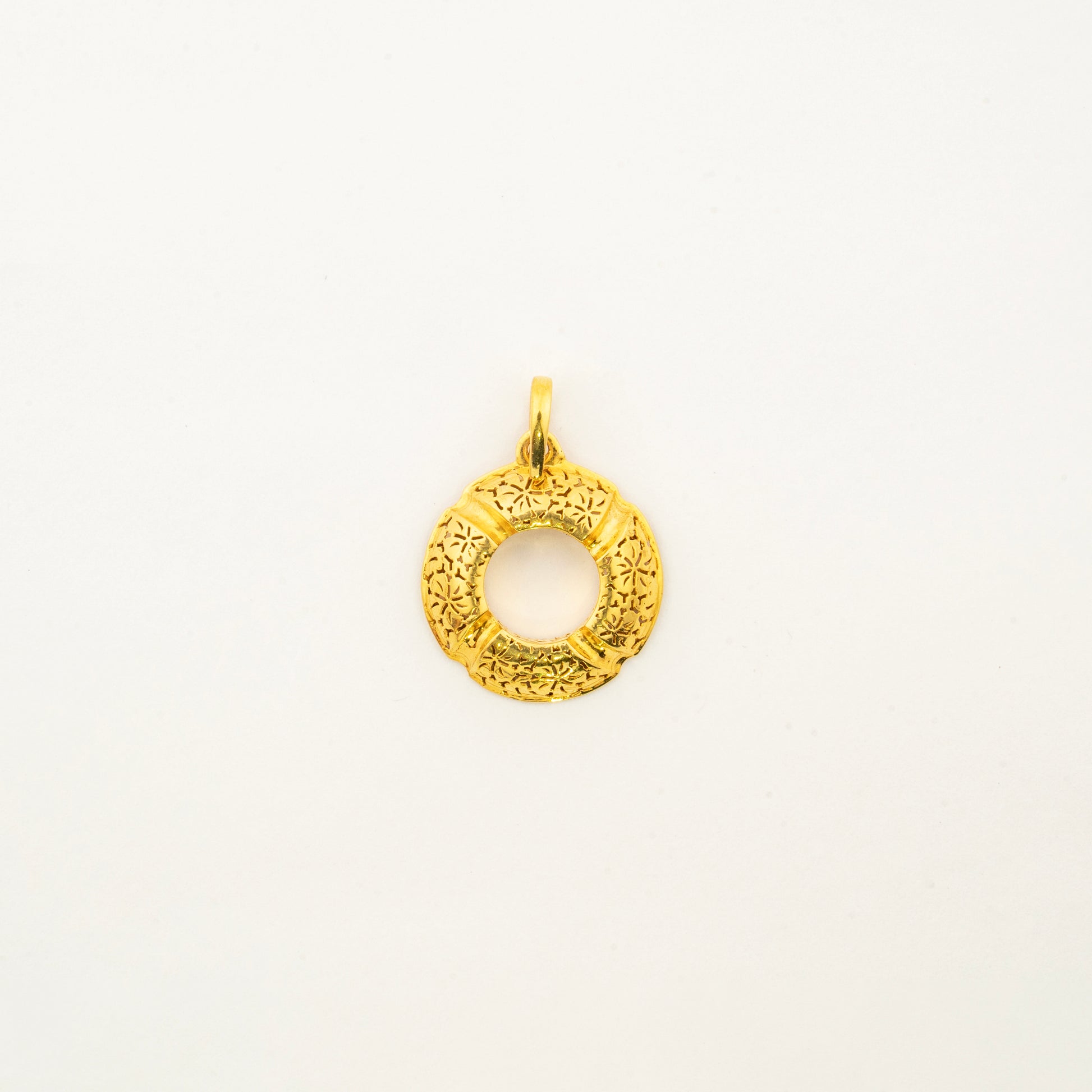 Sculptyx Golden Meridian handcrafted 18K gold circle pendant featuring a minimalist open circular design with a refined textured finish.