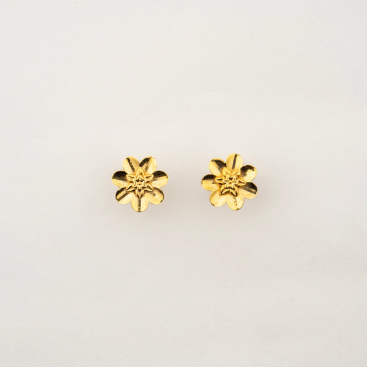 culptyx Lunara Bloom handcrafted 18K gold floral stud earrings featuring a delicate six-petal blossom design.