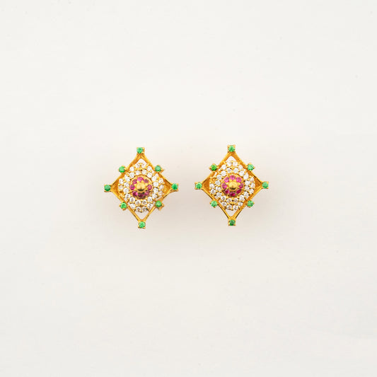 Sculptyx Masrique Rosan handcrafted 22K gold floral stud earrings featuring vibrant red and green gemstone accents.