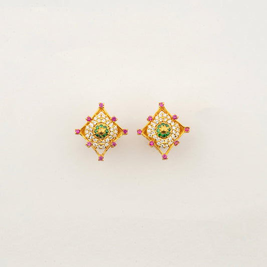 Sculptyx Masrique Verda handcrafted 22K gold floral stud earrings featuring elegant green and red gemstone accents.