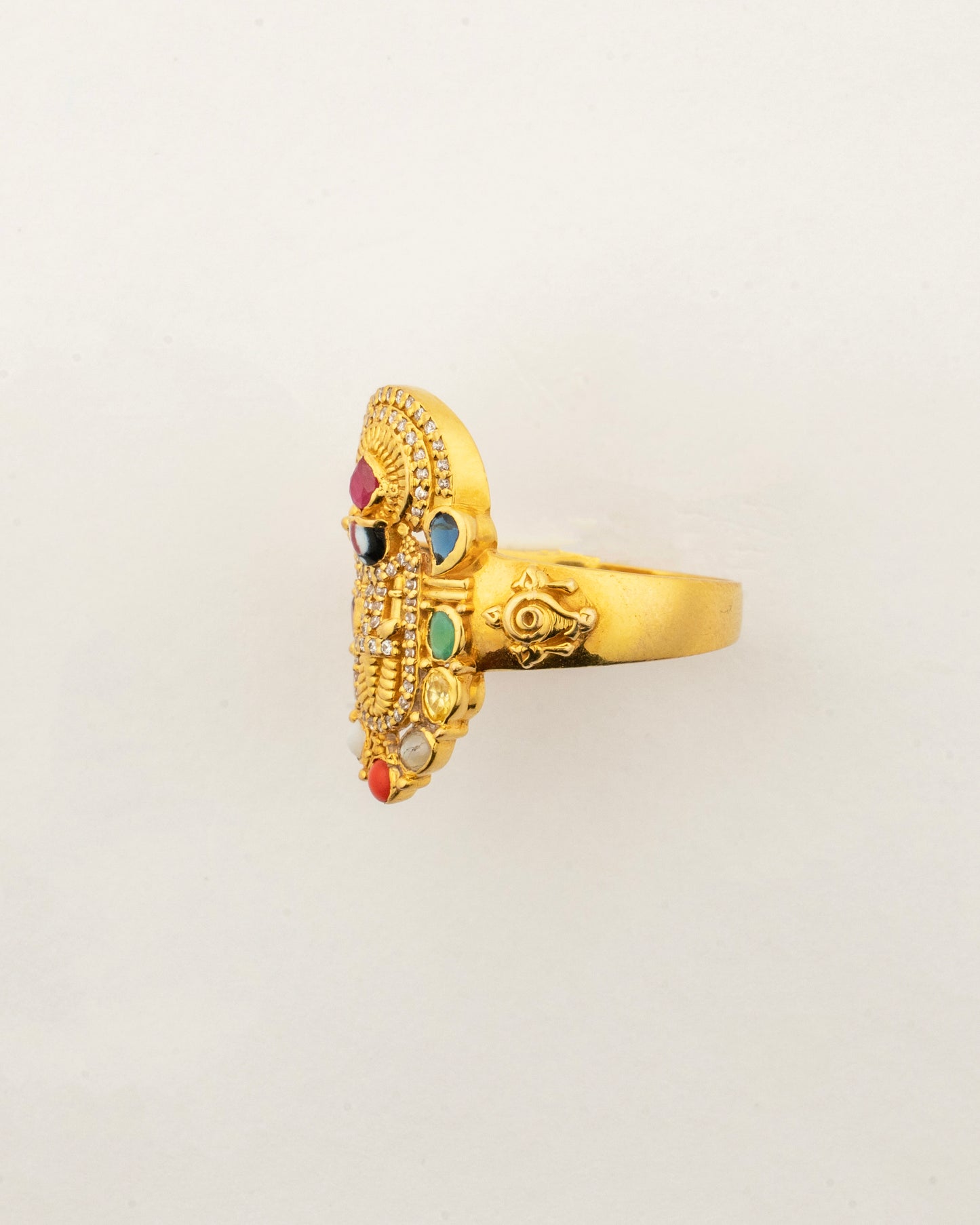 Angled view of the Sculptyx Navaratna Balaji ring displaying the sacred Balaji design and vibrant Navaratna gemstones.