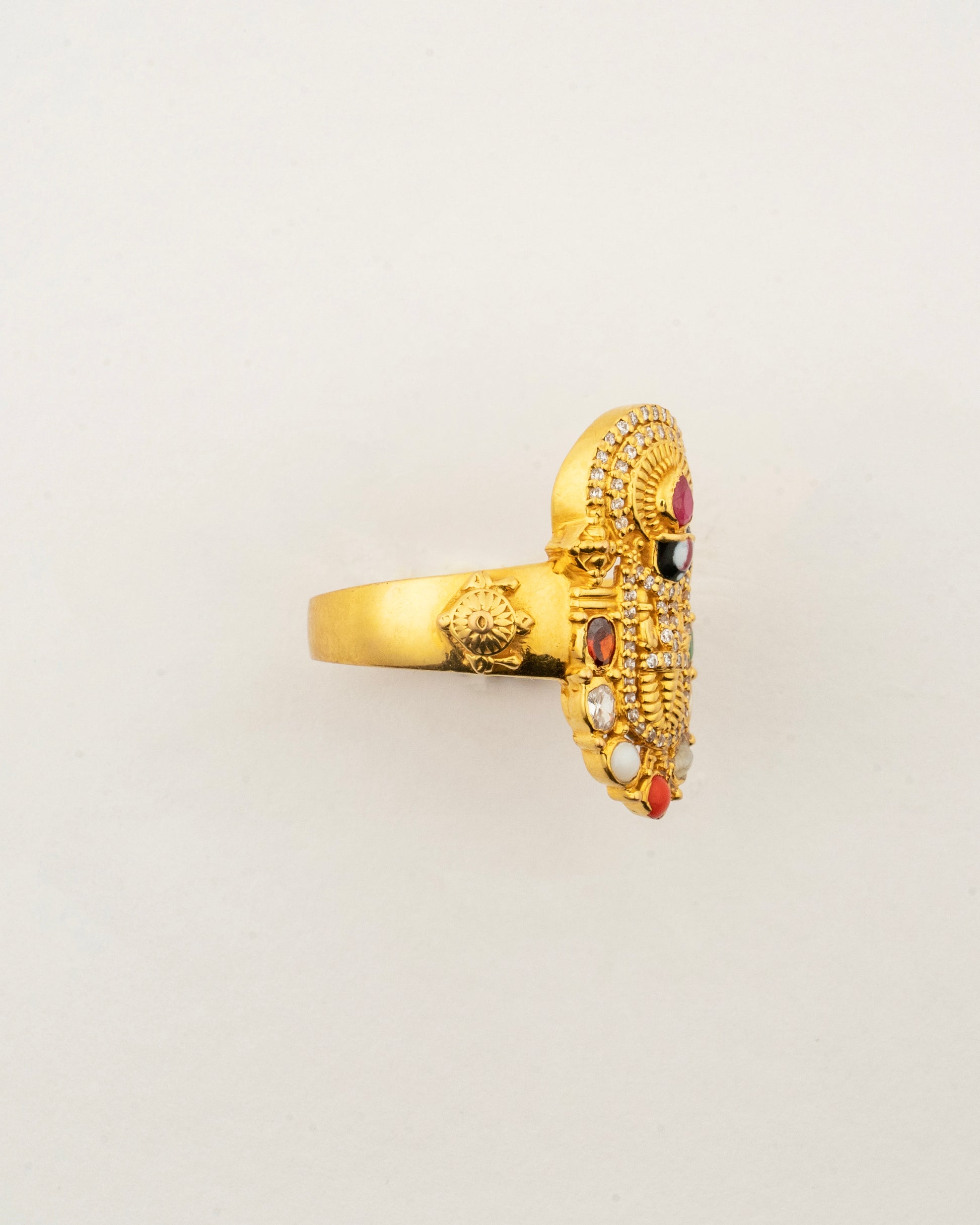 Side profile of the handcrafted 22K gold Navaratna Balaji men's ring highlighting its intricate craftsmanship and gemstone setting.