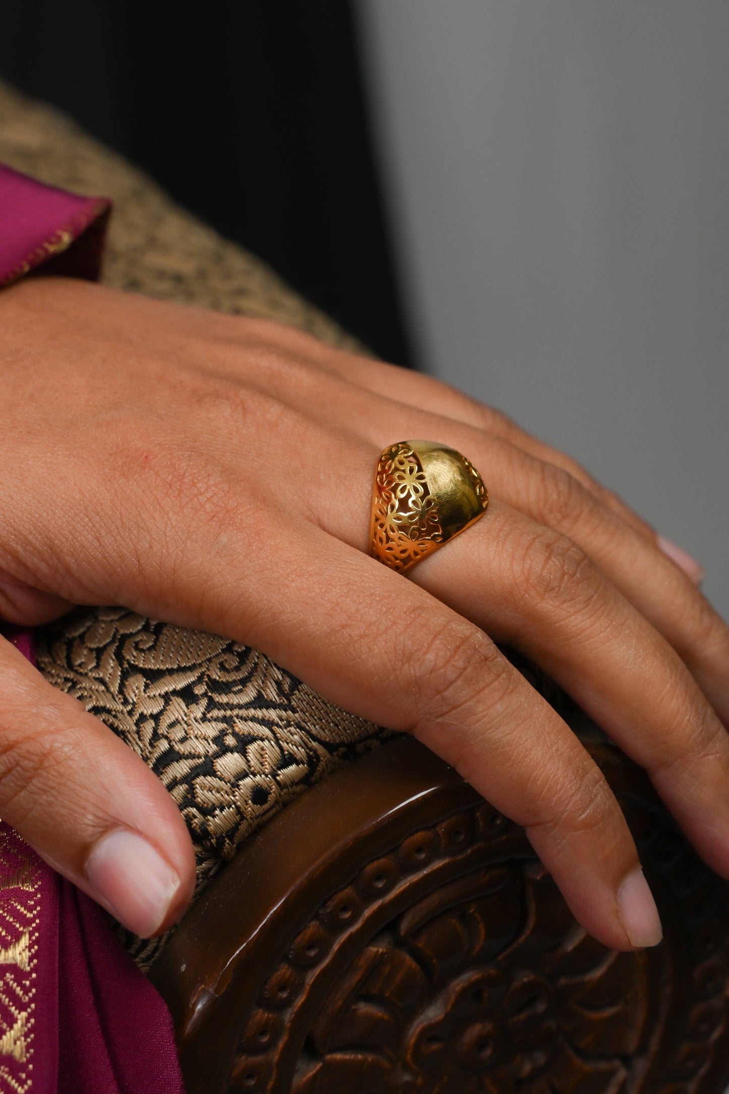 Close-up of the Sculptyx Noctis Bloom luxury 18K gold floral statement ring worn on the hand.