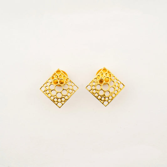 Sculptyx Oculus Aurea handcrafted 18K gold geometric stud earrings featuring an intricate openwork square design.