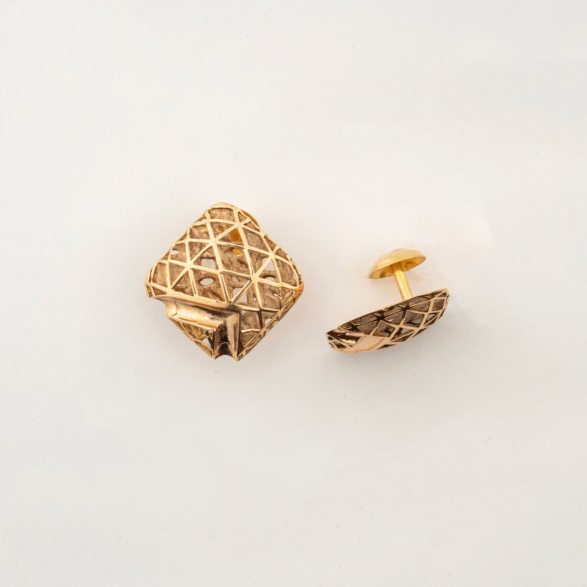 Sculptyx Quadora Gridelle handcrafted 18K gold geometric stud earrings featuring an intricate lattice-inspired contemporary design.