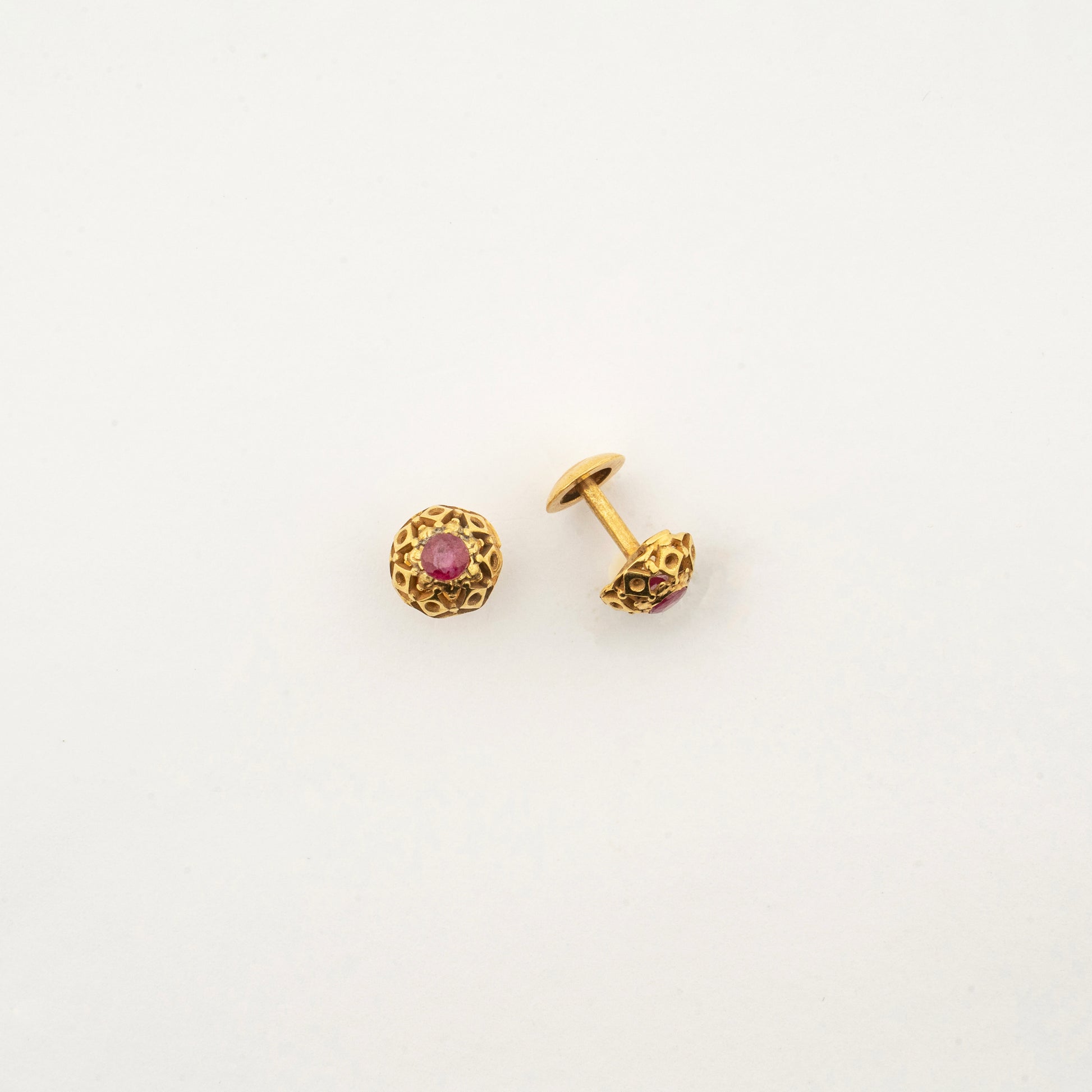Rear view of the Sculptyx Ravikara handcrafted 18K gold ruby stud earrings.