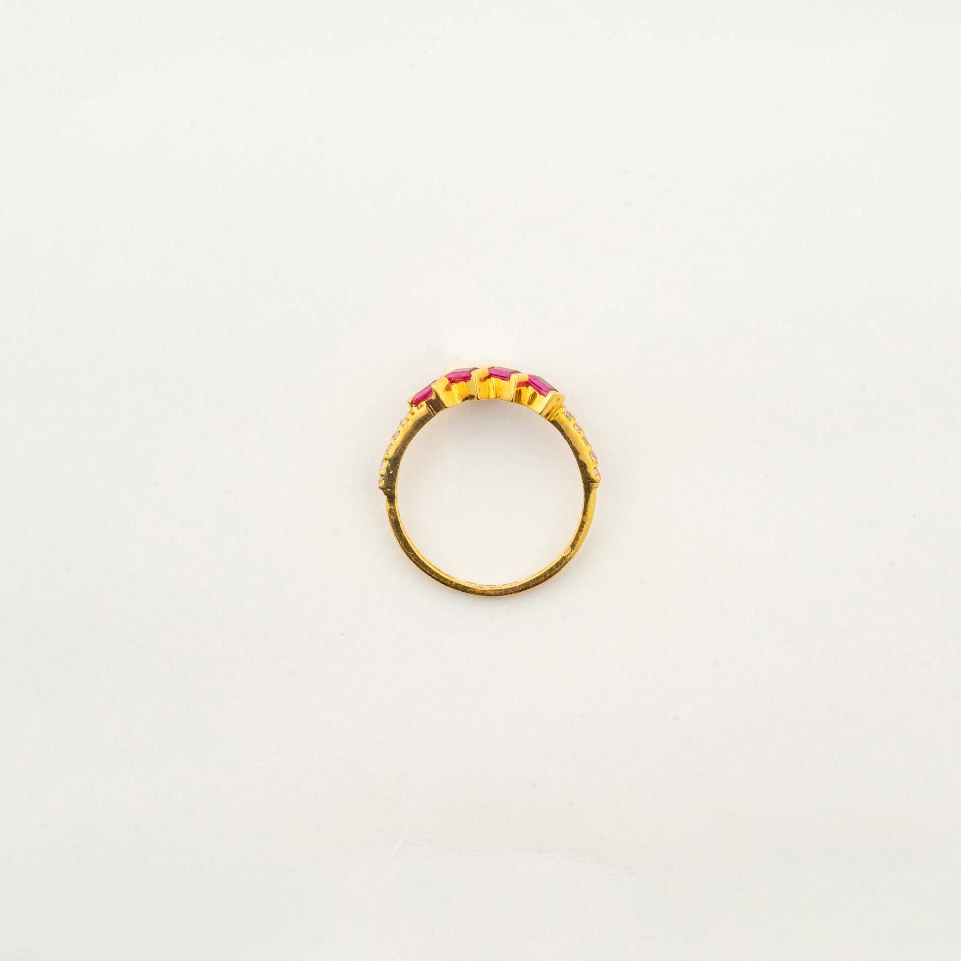 Top view of the handcrafted Sculptyx Rubra Cascade 22K gold ruby ring with precision-set ruby gemstones.