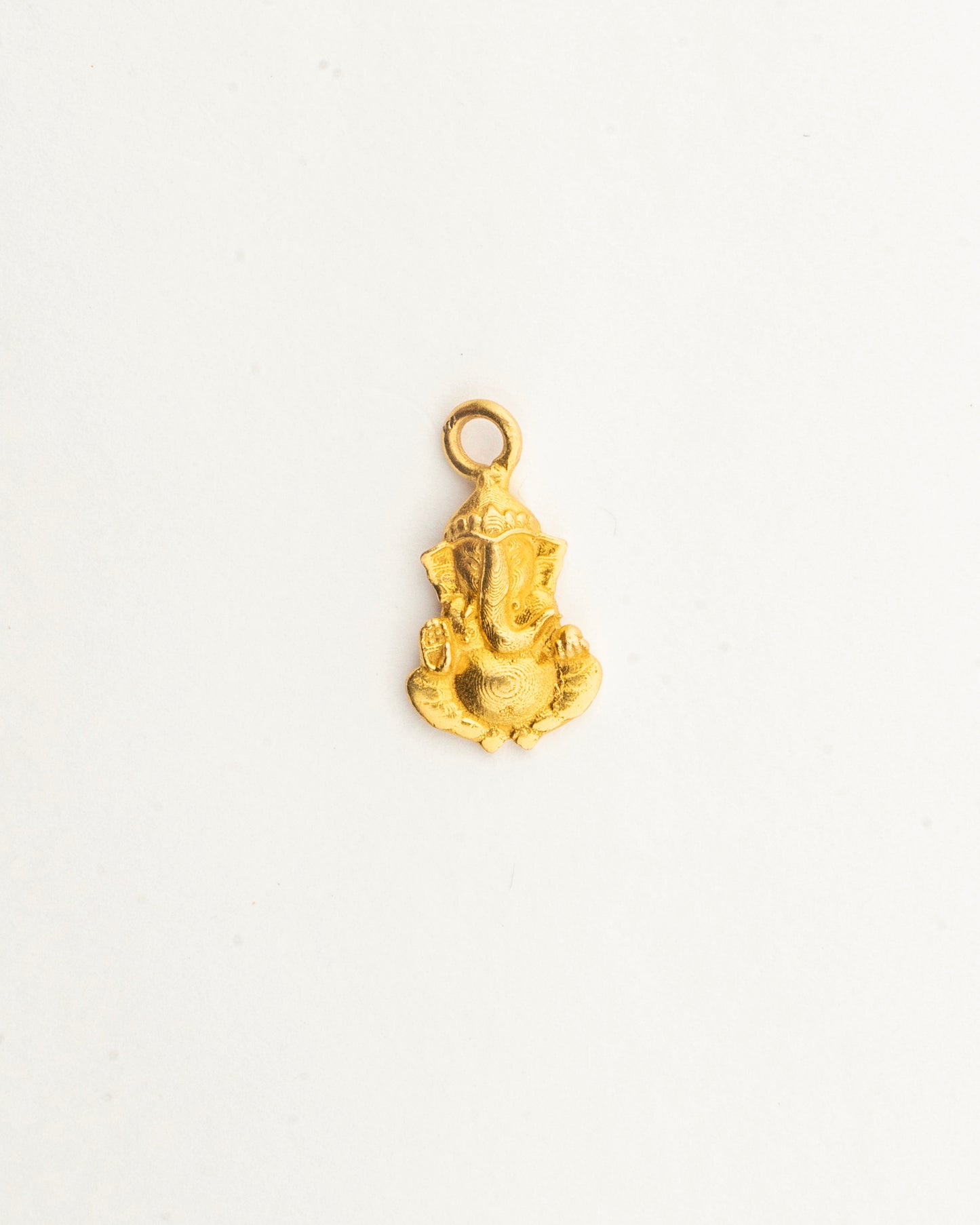 Front view of the Sculptyx Divine Blessings Shree Ganesha 22K gold pendant showcasing detailed devotional craftsmanship.