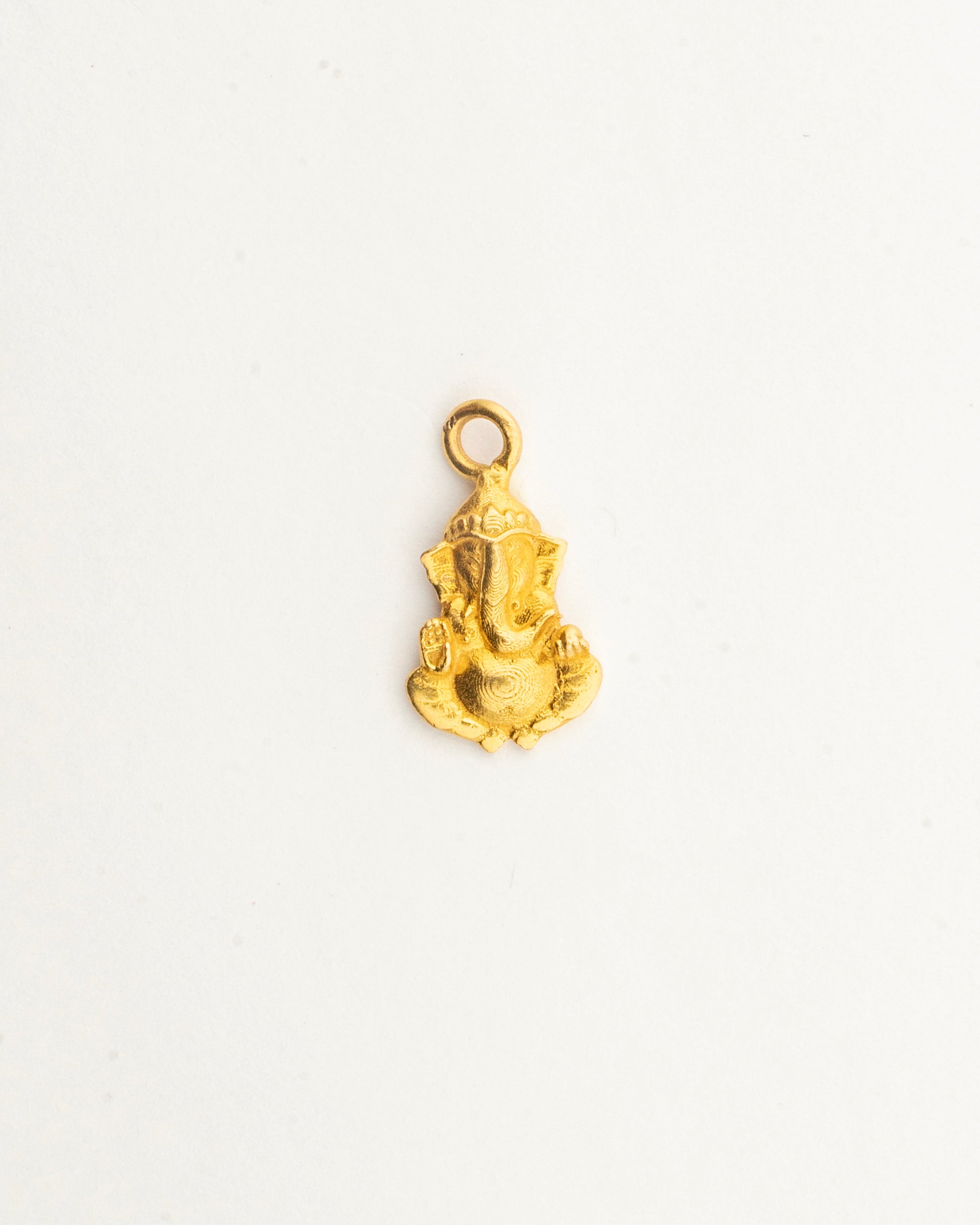 Front view of the Sculptyx Divine Blessings Shree Ganesha 22K gold pendant showcasing detailed devotional craftsmanship.