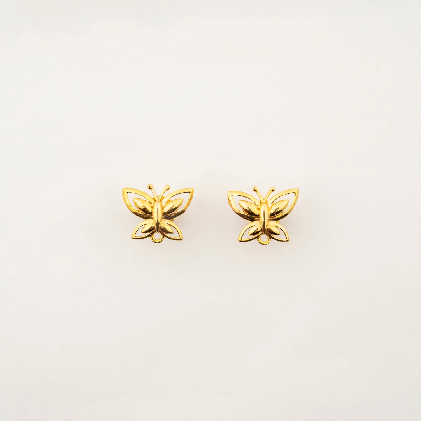 Sculptyx The Lightning Stud handcrafted 18K gold butterfly stud earrings with elegant minimalist design.