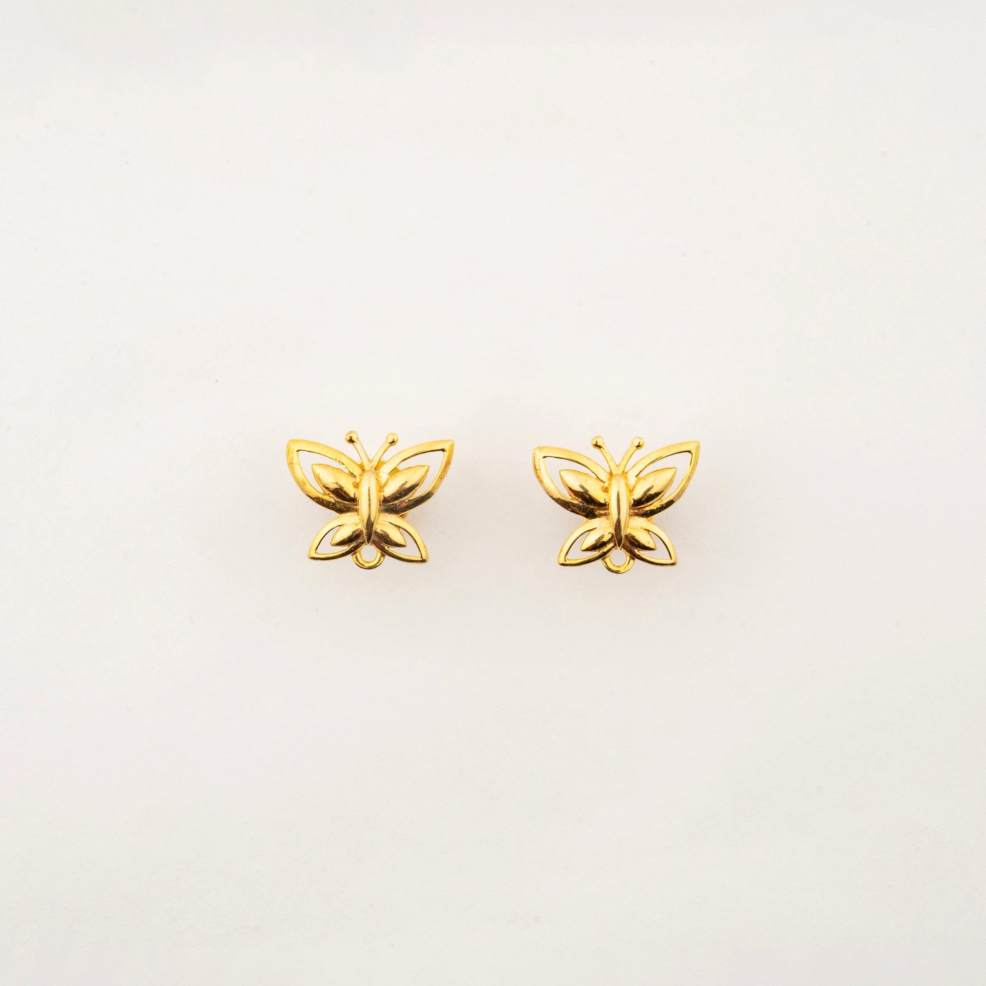 Sculptyx The Lightning Stud handcrafted 18K gold butterfly stud earrings with elegant minimalist design.